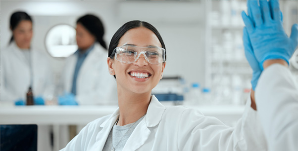 Scientist high fiving a colleague.