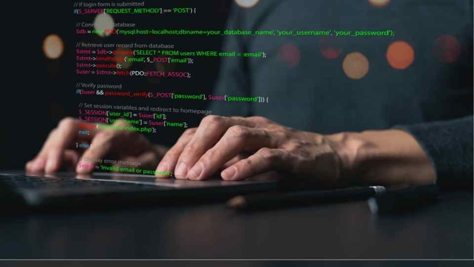Software developer or programmer coding program with laptop. 