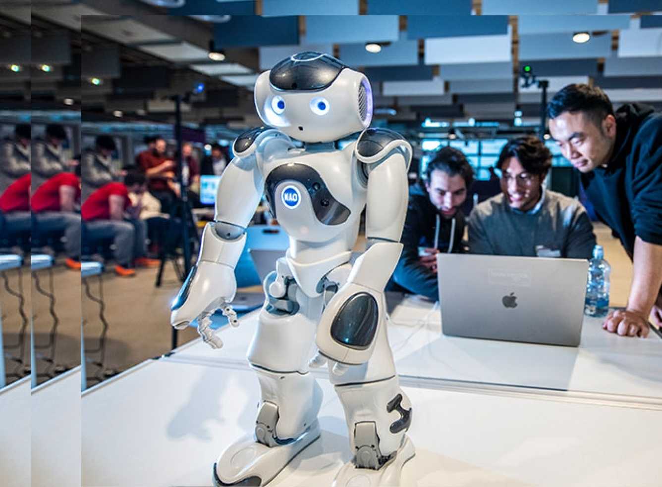 Robot and students in the Engineering Building