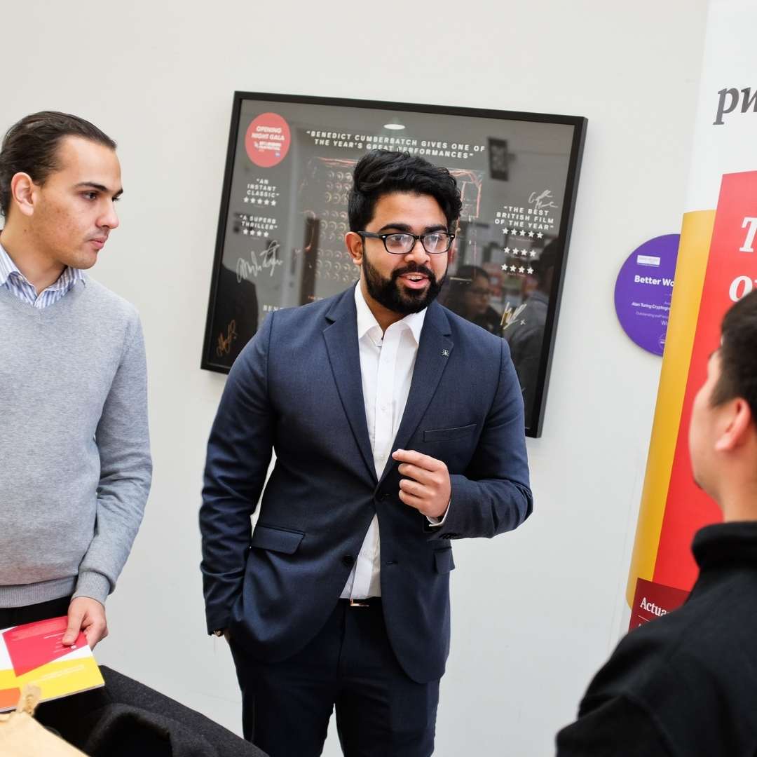 Business students chatting at an event.